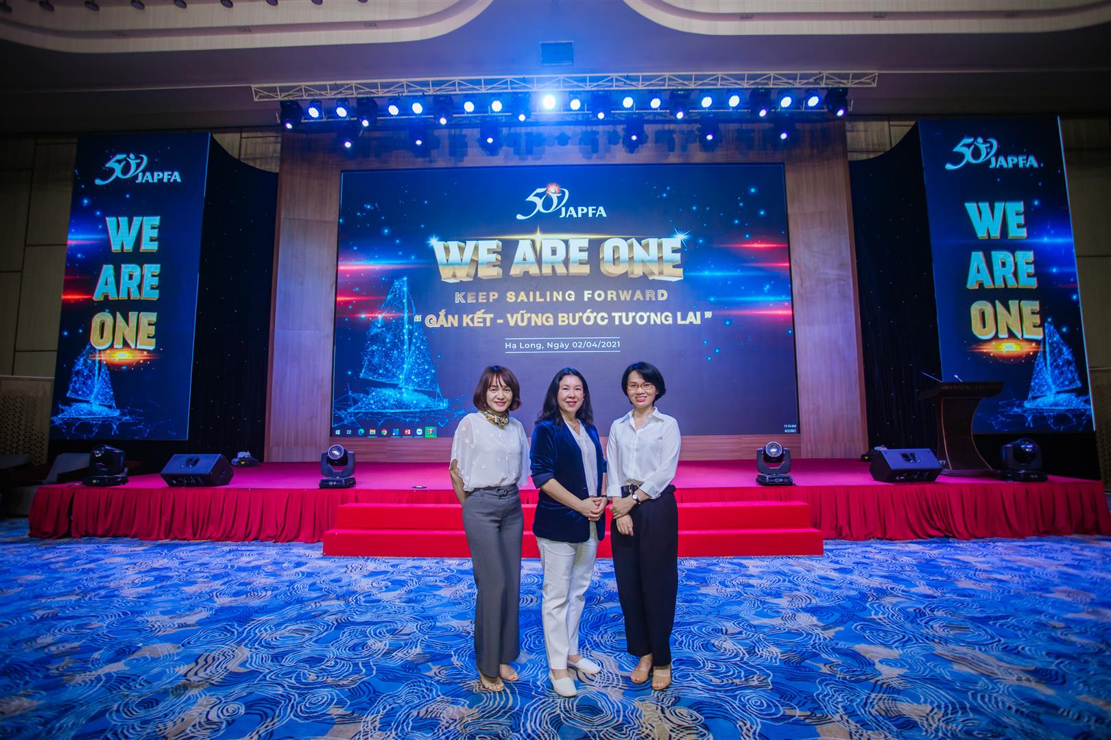 Ms. Hong - Nutrition Director - Japfa North and Ms Supaporn M - Country Manager JJIV person holding feed pellets in hand