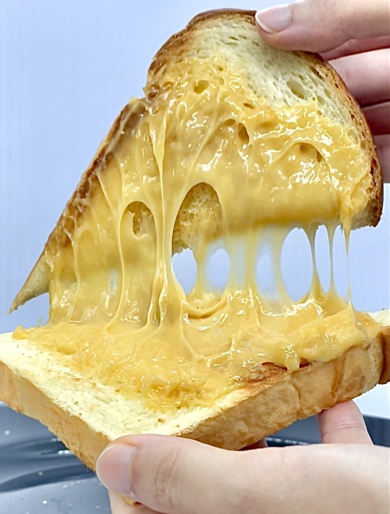 Stretchy Vegan Cheese 1 pouring everday milk tea into a glass