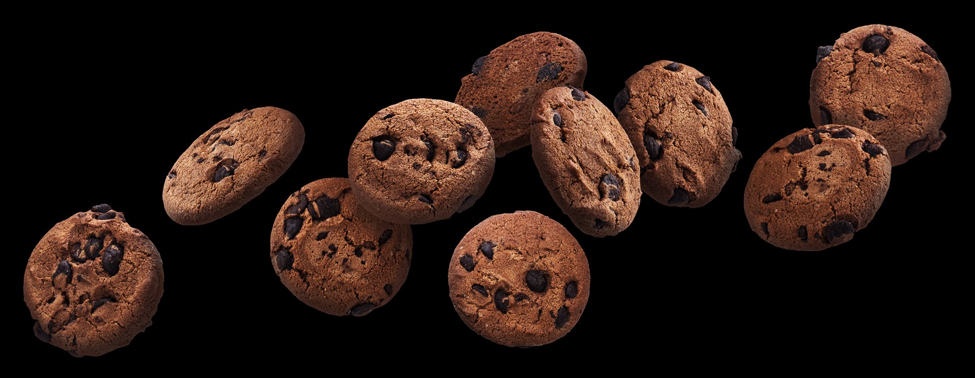 chocolate-chip-cookies-falling-black-background-flying-biscuits