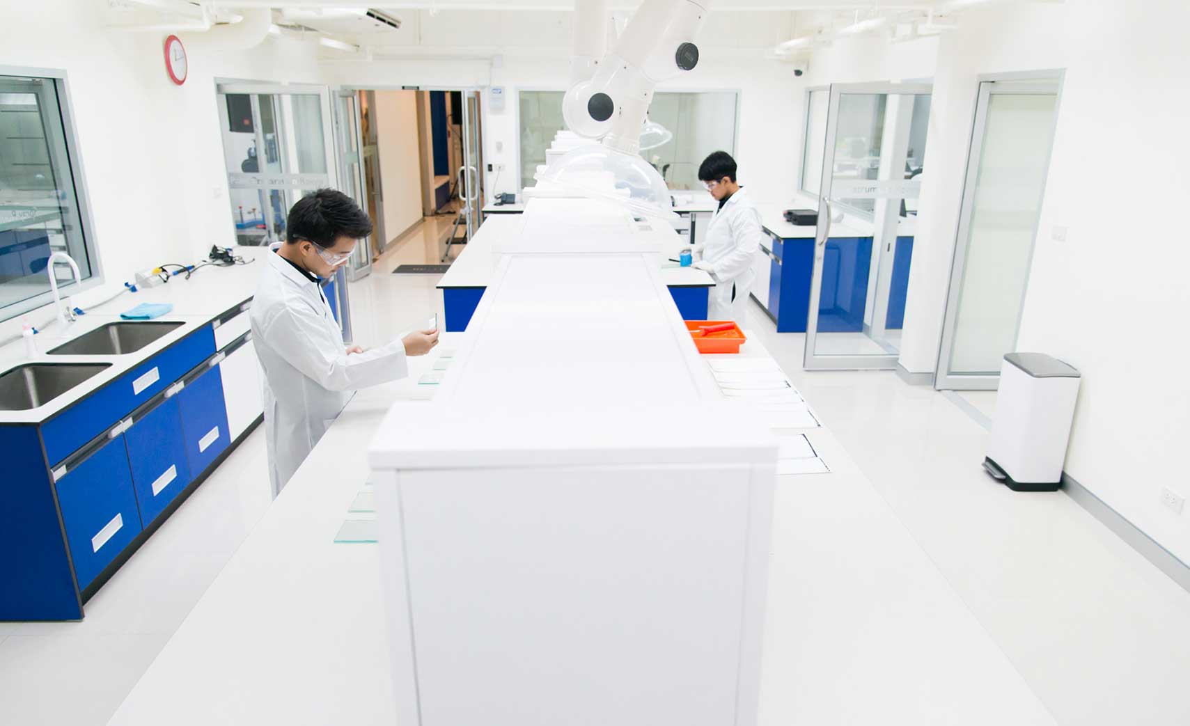 coating-lab-room-technicians Regional Coating Innovation Center main room with technicians testing