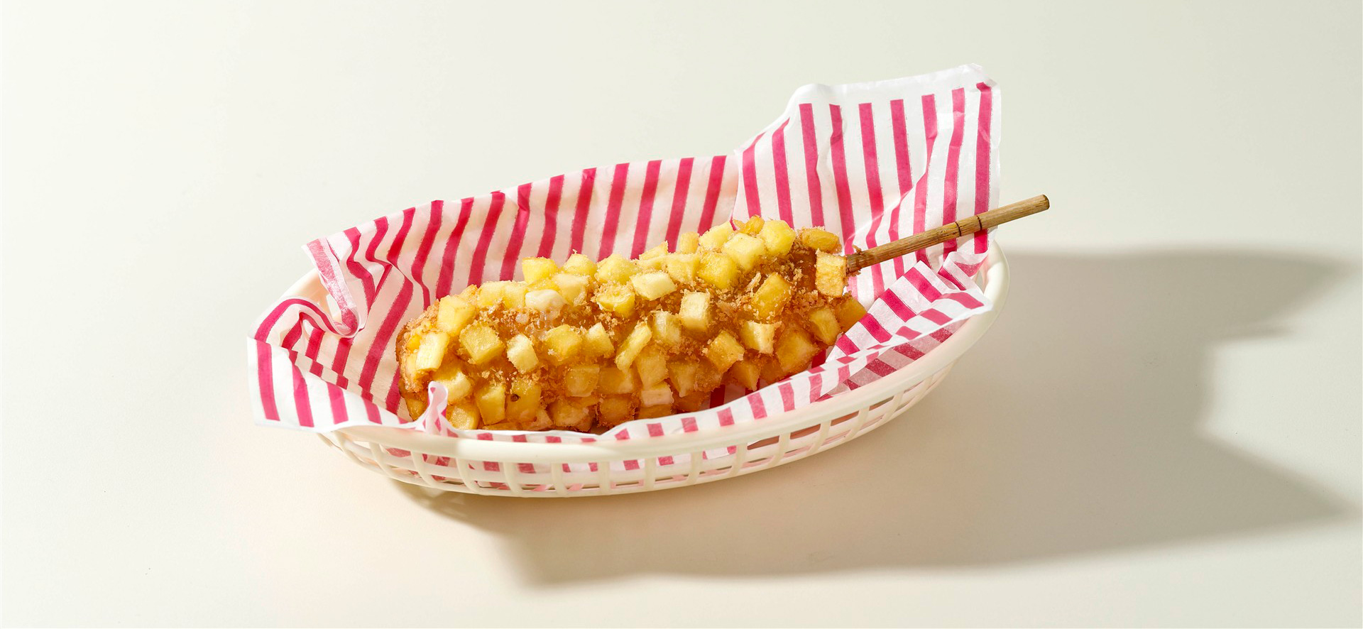 delicious-crunchy-korean-style-chunky-potato-corn-dogs-with-batter-fried-potatoes-(1) high-angle-view-breads-tomatoes-burlap (Custom)