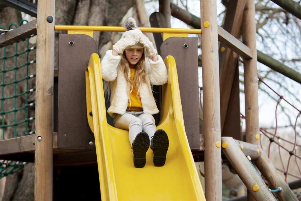 full-shot-kid-playing-slide-Large