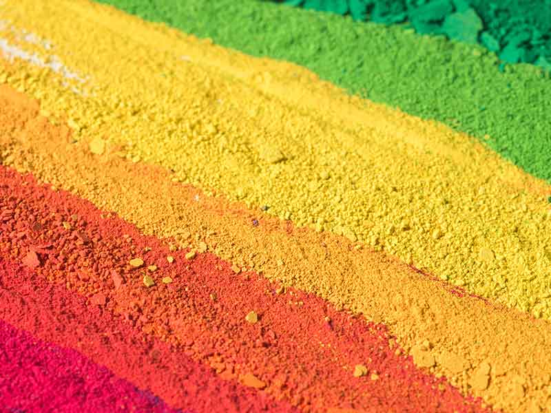 different colours of pigment powders lined up
